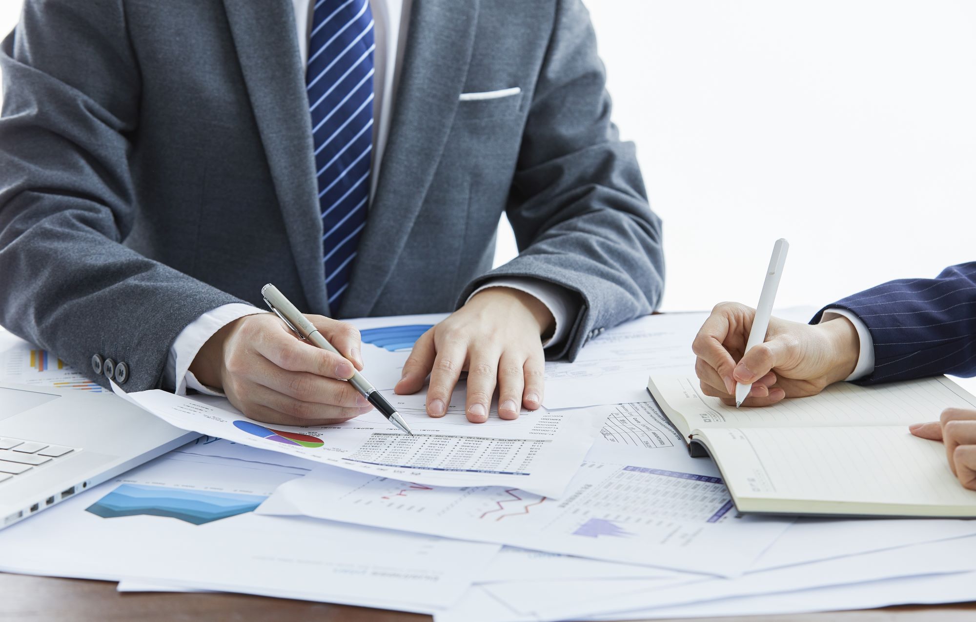 businessmen-in-elegant-suits-at-a-business-meeting-2023-11-27-04-53-32-utc.jpg